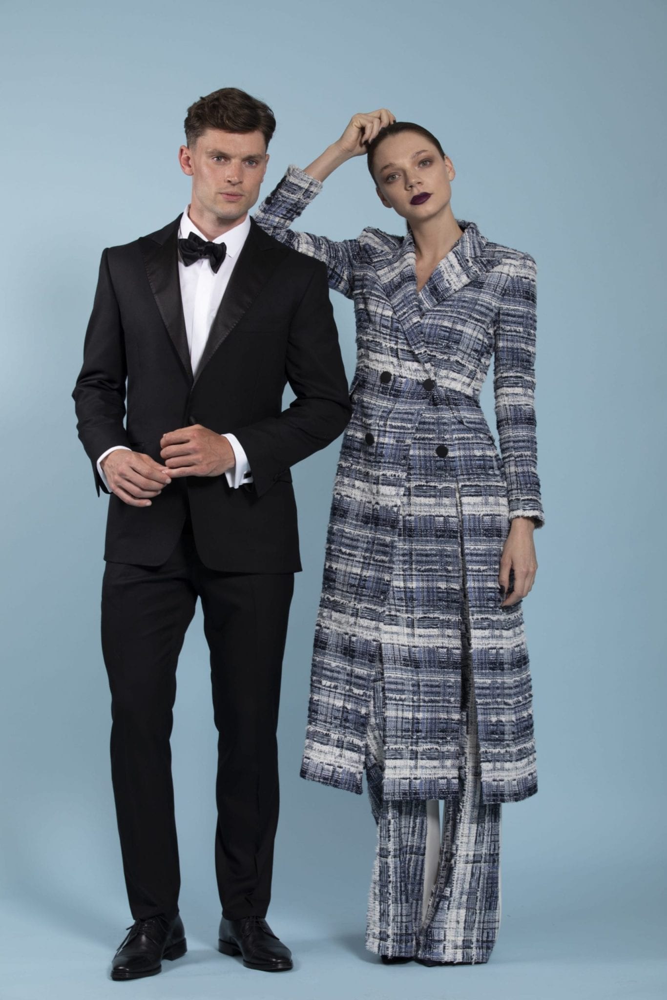 Model Jordan Clyde wearing a bespoke tuxedo with model Noemie Charest wearing a bespoke womens suit in tweed